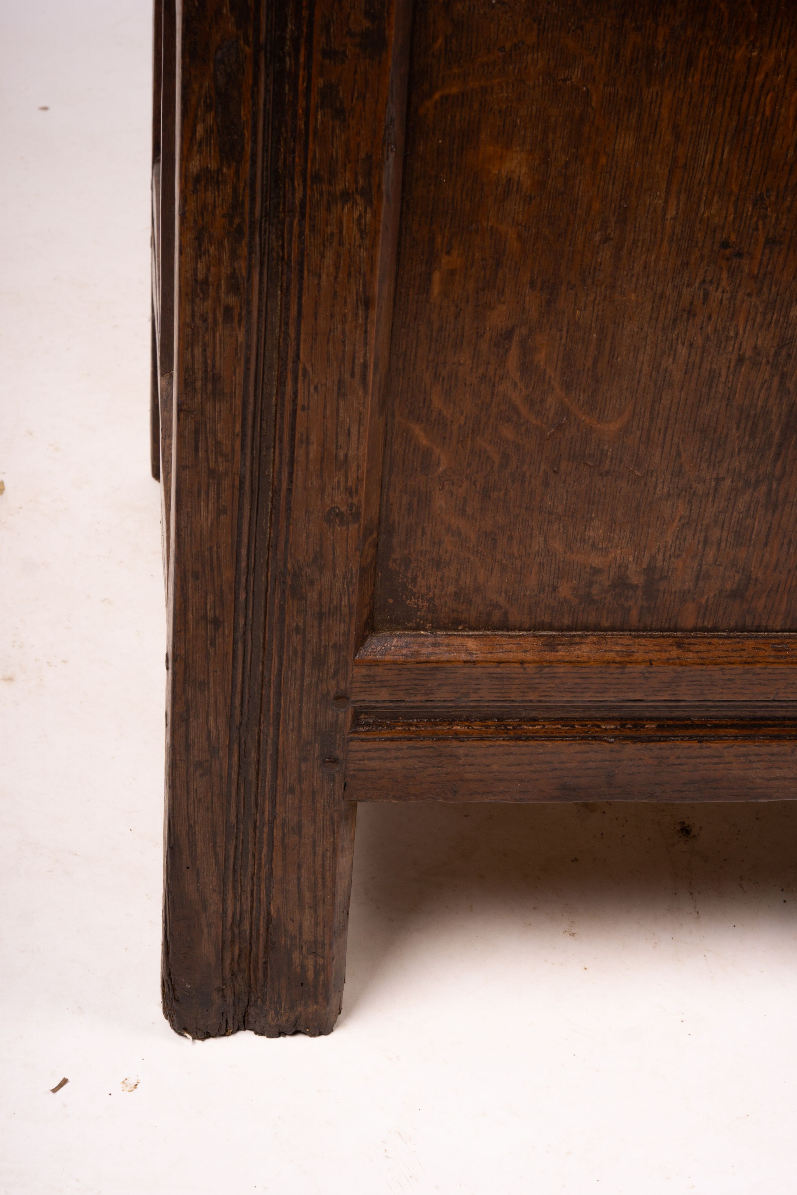 A 17th century panelled oak coffer, W.122cm D.55cm H.65cm